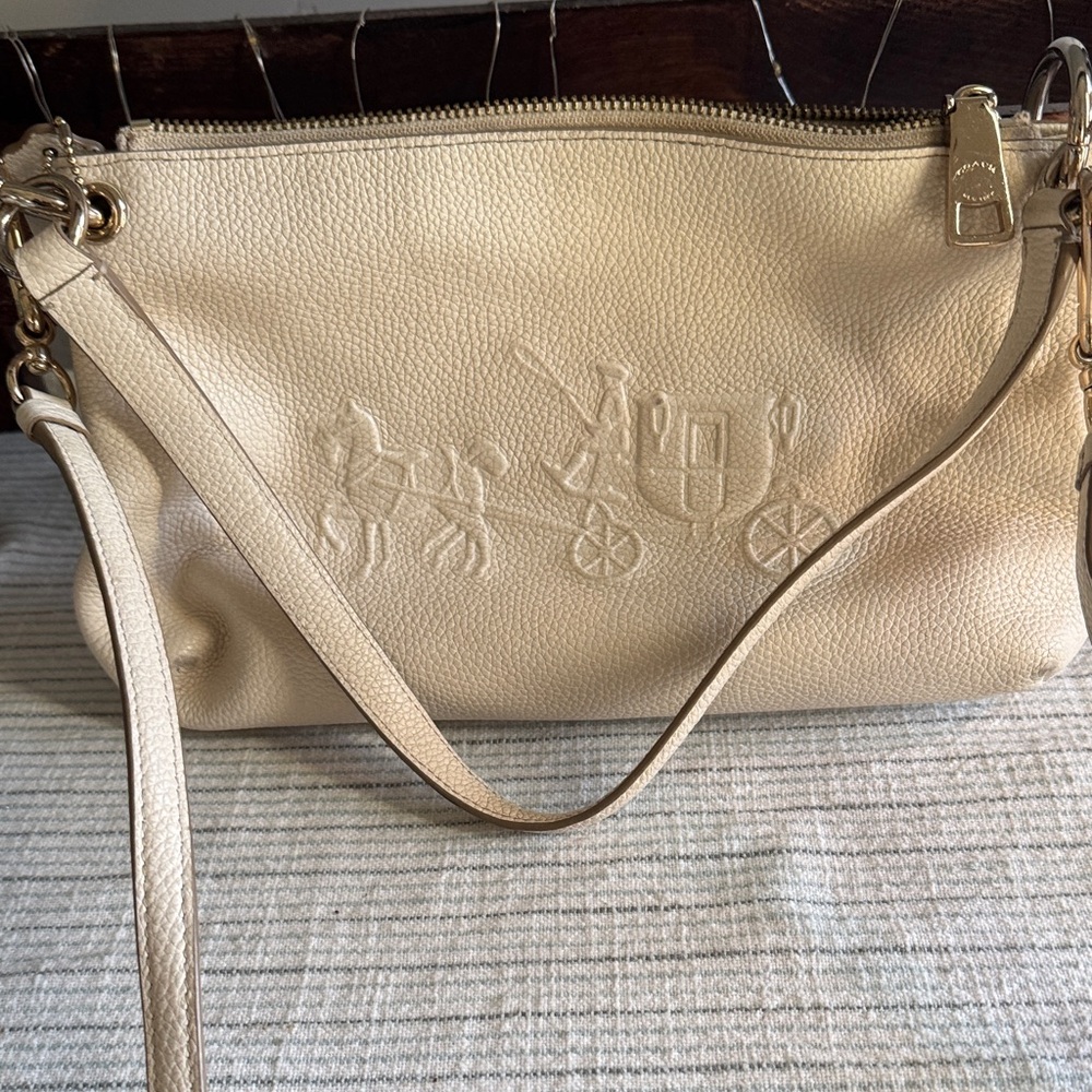 Coach Light cream Leather Crossbody Bag- wrist strap and shoulder strap.